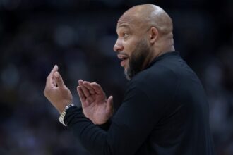 Head coach Darvin Ham of the Los Angeles Lakers directs his team against the Denver Nuggets in the first quarter during game five of the Western Conference First Round Playoffs at Ball Arena.