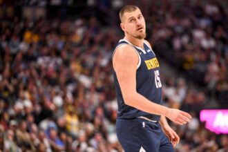 Nikola Jokic (15) of the Denver Nuggets stands on the court during the second quarter against the Phoenix Suns