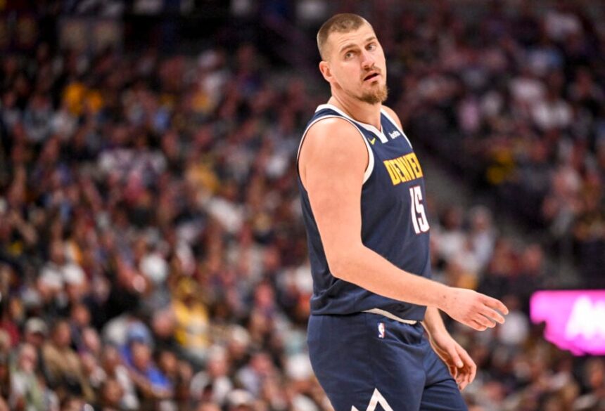 Nikola Jokic (15) of the Denver Nuggets stands on the court during the second quarter against the Phoenix Suns