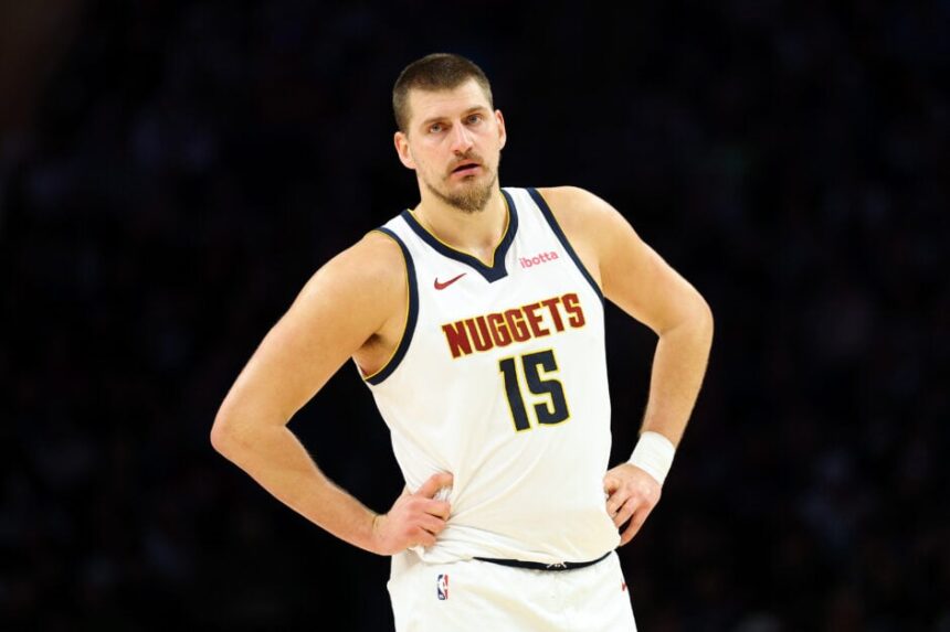 Nikola Jokić #15 of the Denver Nuggets looks on against the Minnesota Timberwolves in the third quarter at Target Center.