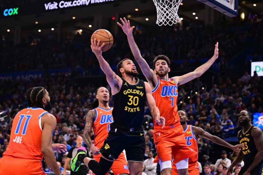 Stephen Curry #30 of the Golden State Warriors attempts a shot in front of Chet Holmgren #7 of the Oklahoma City Thunder during the first half at Paycom Center on November 11, 2025 in Oklahoma City, Oklahoma.