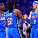Alex Caruso #9, Cason Wallace #22 and Shai Gilgeous-Alexander #2 of the Oklahoma City Thunder react during the fourth quarter against the Denver Nuggets in Game Seven of the Western Conference Second Round NBA Playoffs at Paycom Center on May 18, 2025 in Oklahoma City, Oklahoma.