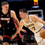 Los Angeles Lakers guard Luka Doncic (77) drives to the basket against Miami Heat forward Nikola Jovic (5) during the first half of an NBA basketball game at Crypto.com Arena.