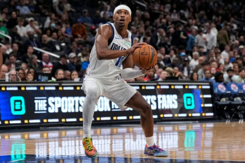 Brandon Williams #10 of the Dallas Mavericks drives to the hoop during the second half against the Washington Wizards at Capital One Arena.