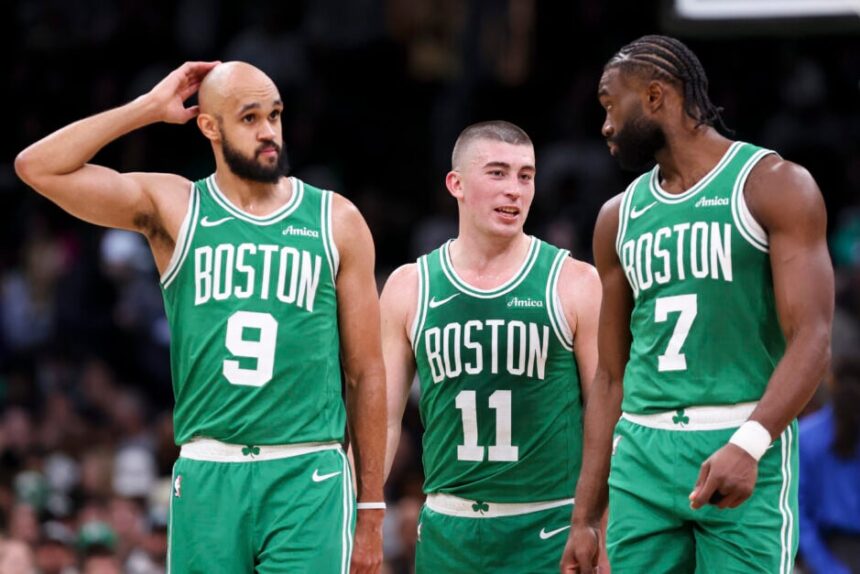 Derrick White #9 of the Boston Celtics, Payton Pritchard #11 of the Boston Celtics, Jaylen Brown #7 of the Boston Celtics react during a game against the Detroit Pistons.