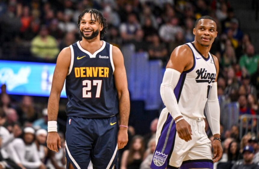 Jamal Murray (27) of the Denver Nuggets jokes with Russell Westbrook (18) of the Sacramento Kings during the fourth quarter of the Nuggets' 130-124 win at Ball Arena in Denver, Colorado on Monday, November 3, 2025.