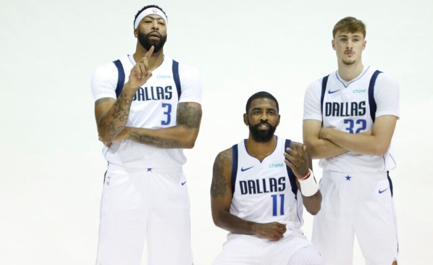 Dallas Mavericks players Anthony Davis #3, Kyrie Irving #11 and Cooper Flagg #32 stand for a photo during Dallas Mavericks media day at American Airlines Center.