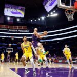 Dillon Brooks #3 of the Phoenix Suns takes a shot against Gabe Vincent #7 of the Los Angeles Lakers