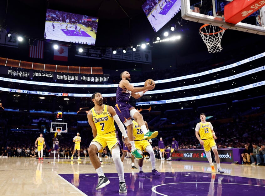 Dillon Brooks #3 of the Phoenix Suns takes a shot against Gabe Vincent #7 of the Los Angeles Lakers